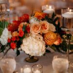 A Beautiful Flower Arrangement Surrounded with Elegant Candles